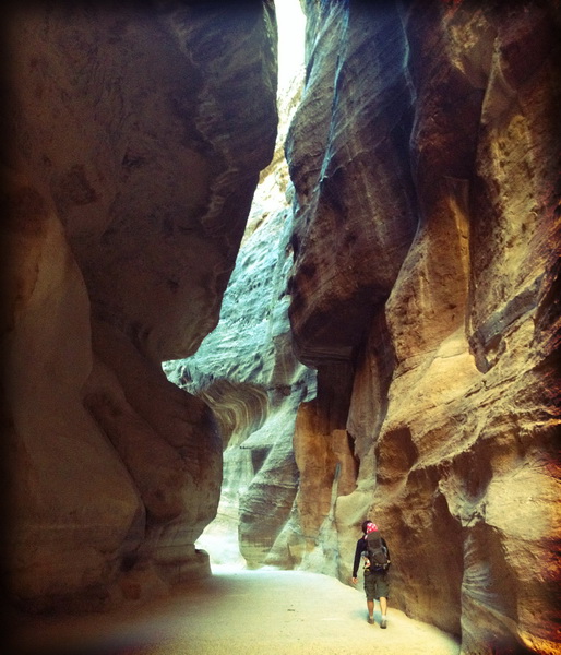 Walking through the narrow canyon Siq entrance to Petra