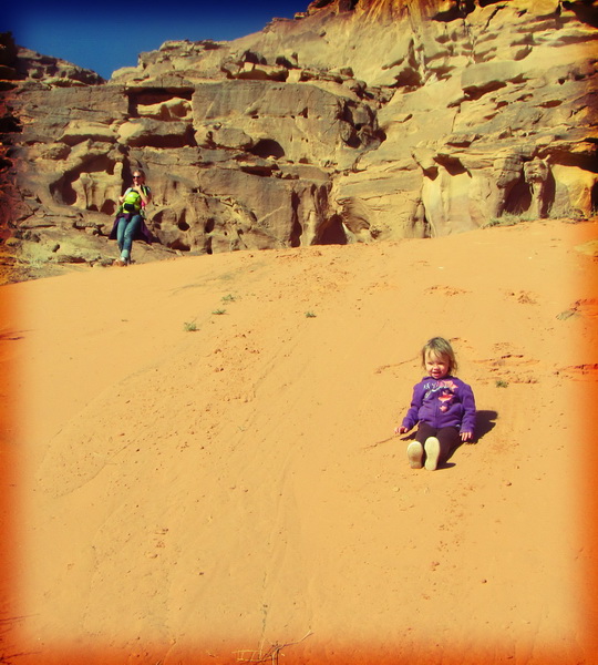 Aya enjoying sliding down sand dunes