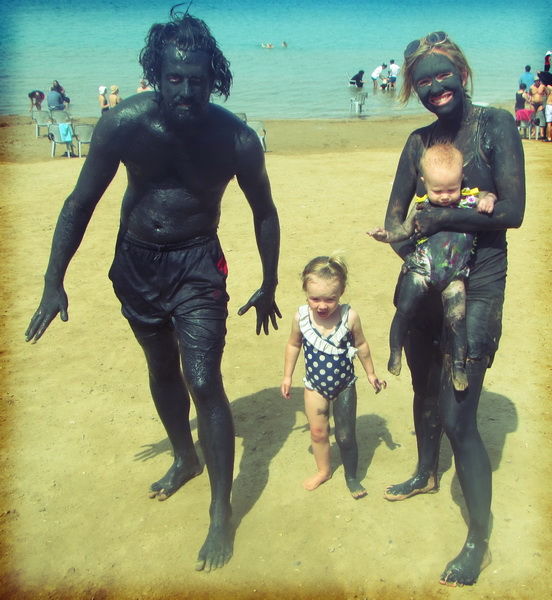 Family mud bath at the dead sea